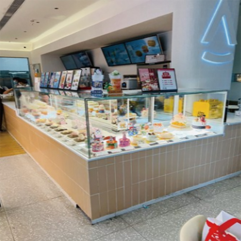 Vertical sliding door cake display case